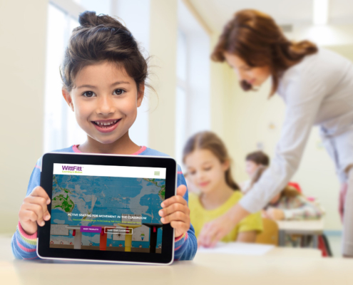 Retail Website Design image of girl with tablet and WittFitt logo